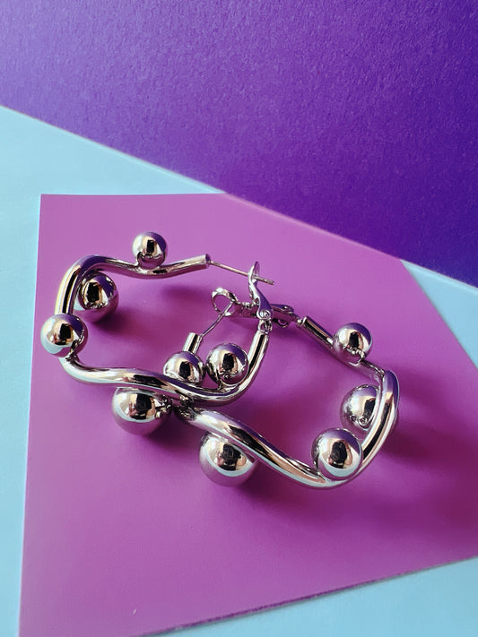 Zarcillos-TWIST SILVER HOOPS