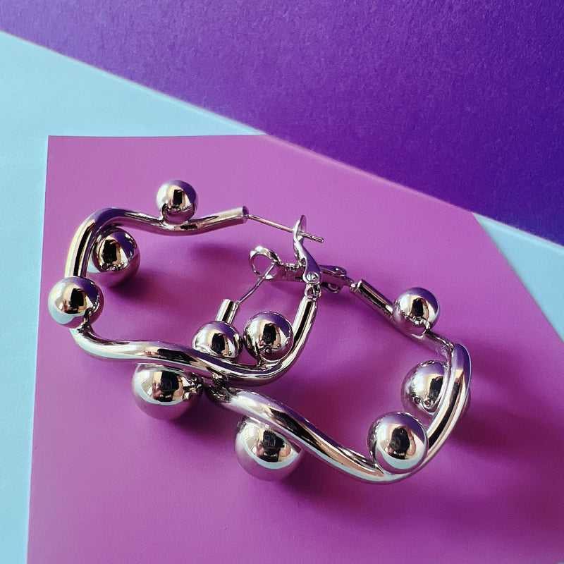 Zarcillos-TWIST SILVER HOOPS